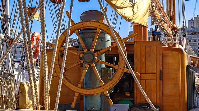 The helm of a boat showing the wheel