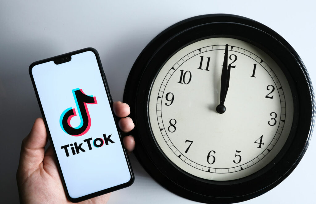 best time to post on tiktok clock and phone